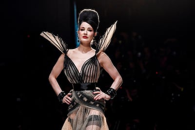 US actress Dita Von Teese presents a creation by Jean-Paul Gaultier. AFP