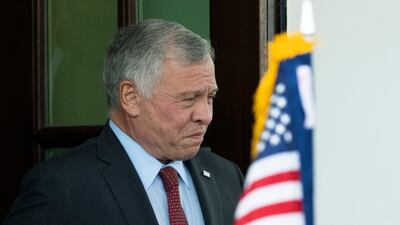 King Abdullah leaves the White House after a lunch with Mr Biden. AP