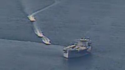 Iranian Revolutionary Guard Corps Navy vessels approach the USS Lewis B Puller in the northern waters of the Arabian Gulf.