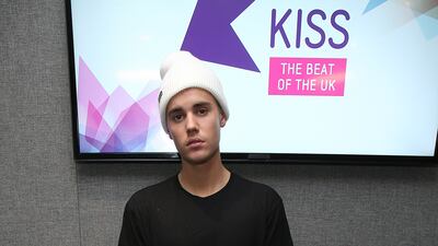 In a knitted beanie and basketball shorts to visit Kiss FM Studios on October 23, 2015, in London. Getty Images