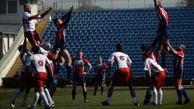 Russia rugby union, right, and Crimea rugby union, left, players vie for the ball during a line-out on Saturday. Filippo Monteforte / AFP / March 15, 2014