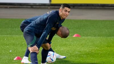 Cristiano Ronaldo stretches with teammate Pepe, in the background, during a Portugal soccer team training session. Ronaldo recently gave a series of explosive interviews with a British talkshow host criticising his club Manchester United. AP Photo