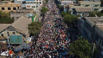 Protesters march on a road during a demonstration against the military coup in Shwebo in Myanmar's Sagaing Region. AFP