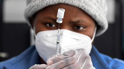 A nurse prepares a Pfizer-BioNTech Covid-19 shot at a public housing project pop-up vaccination site in Los Angeles, California, US. AFP