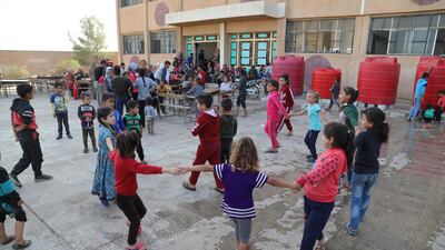Displaced Kurdish children who fled their home town of Ras al-Ain city play at temporary shelter in a school building at Tal Tamr town, northeast of Syria. Turkey has launched an offensive targeting Kurdish forces in north-eastern Syria, days after the US withdrew troops from the area. EPA