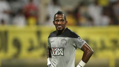 Al Ahli goalkeeper Majed Naser pauses during the Arabian Gulf League match against Al Wasl at Zabeel Stadium in Dubai on September 26, 2014. Courtesy Al Ittihad
