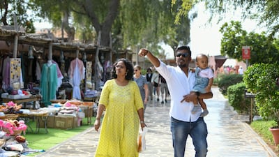 Tourists explore Heritage Village, Abu Dhabi. Khushnum Bhandari / The National