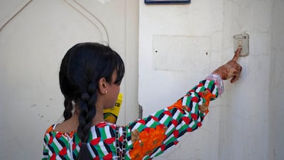 “More, more, more,� children squealed as they ran from house to house, gobbling sweets while knocking on doors. With one hand extended they pushed the other into their bags to make more room.