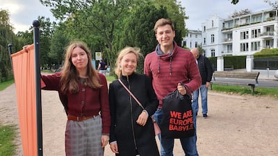 Viktoria Priewe, 16; Helen Bannister, 29; and Frederic Artus, 23, on the banks of the Outer Alster lake in Hamburg. Tim Stickings / The National