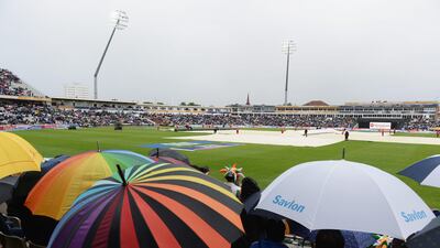 BIRMINGHAM, ENGLAND - JUNE 23: Spectators shelter from the rain with the covers on during the ICC Champions Trophy Final between England and India at Edgbaston on June 23, 2013 in Birmingham, England. (Photo by Gareth Copley/Getty Images) *** Local Caption *** 171190075.jpg
