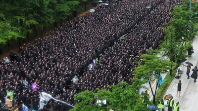 Samsung Electronics workers gather at a rally at the start of a three-day general strike, outside the company's Hwaseong campus in South Korea. AP