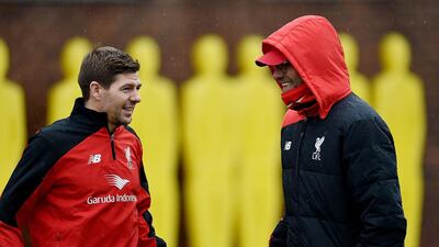 In this file photo Steven Gerrard talks with Jurgen Klopp, manager of Liverpool, during a training session at Melwood Training Ground on November 30, 2015 in Liverpool, England. Andrew Powell / Getty Images