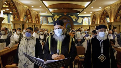 An Orthodox Egyptian Christian priest observes Good Friday prayers at church in Heliopolis in Cairo, Egypt, 30 April 2021. EPA