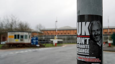A sticker of WikiLeaks founder Julian Assange is attached to a sign outside HMP Belmarsh prison in London. Reuters