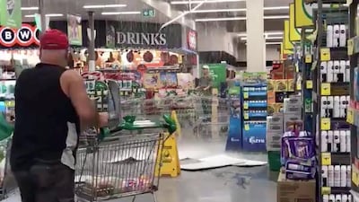 A man pushes a cart away as a roof partially collapsed due to hailstorm, at a market in Templestowe, Victoria, Australia. Reuters