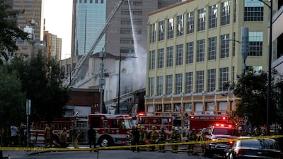 Los Angeles Fire Department firefighters work the scene of a structure fire that injured multiple firefighters, according to a fire department spokesman, in Los Angeles. AP Photo