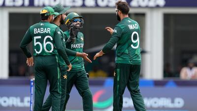 Pakistan's Imad Wasim, right, celebrates with teammates the wicket of Ireland's Gareth Delany. AP