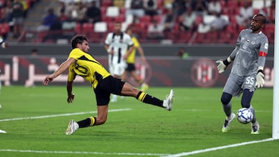 Houssem Aouar scores Al Ittihad's third goal in a 4-1 win to seal a place in the AFC Champions League Elite league phase.