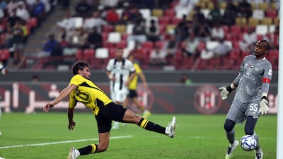 Houssem Aouar scores Al Ittihad's third goal in a 4-1 win to seal a place in the AFC Champions League Elite league phase.