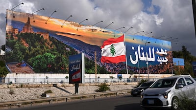 A newly installed billboard with a statement that reads 'Lebanon a new era' on the road leading to Beirut's Rafic Hariri International airport. AFP