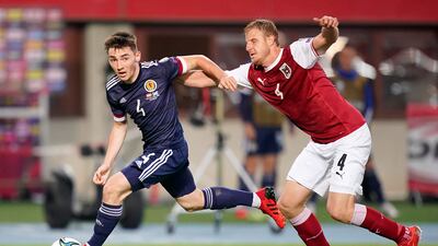 Billy Gilmour of Scotland battles for possession with Martin Hinteregger of Austria. Getty Images