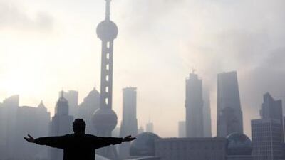 A man practices tai chi at the Bund, which has been reopened after a massive renovation for the Shanghai World Expo 2010.