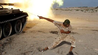 A Libyan fighter allied with the UN-backed government fires a shell at ISIL fighters in Sirte on August 2, 2016. Goran Tomasevic/Reuters