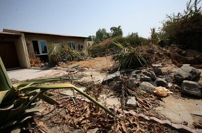 Trees and fence are demolished in Jebel Ali Village as villagers left their houses in 2008. Paulo Vecina/The National