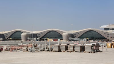 Building materials sit on the aircraft runway area outside Abu Dhabi airport's Midfield terminal during construction. Natalie Naccache / Bloomberg