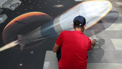 Saggaf Alhashmi paints 3D artwork at City Walk in Dubai. Chris Whiteoak / The National