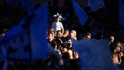Fans look on during the Manchester City Teams Celebration Parade in Manchester, England. Getty Images