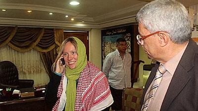 A Norwegian tourist, who was kidnapped by armed Bedouin tribesmen, talks on the phone to relatives at a police station in El Arish.
