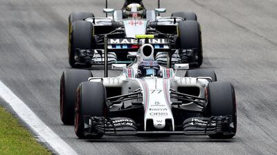 Williams driver Valtteri Bottas drives ahead of Lewis Hamilton of Mercedes during the Formula One Italian Grand Prix. Giuseppe Cacace / AFP
