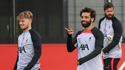 Liverpool's Harvey Elliott, Mohamed Salah and Alisson Becker during training ahead of their Champions League match against Rangers. AFP