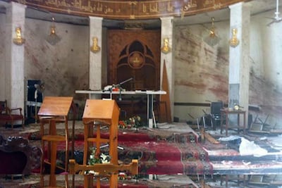 A photo taken on a mobile phone on November 2, 2010 shows the damage inside the Our Lady of Salvation Church in Baghdad after a militant attack on October 31 that year. AP