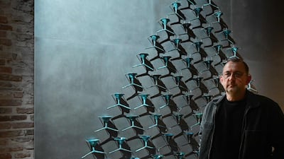 Ukrainian artist Pavlo Makov with his piece 'The Fountain of Exhaustion' at Ukraine's pavilion at the Venice Biennale 2022. AFP