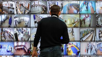 A huge screen shows live feeds from polling stations across Russia at the country's Central Electoral Commission headquarters in Moscow. AFP