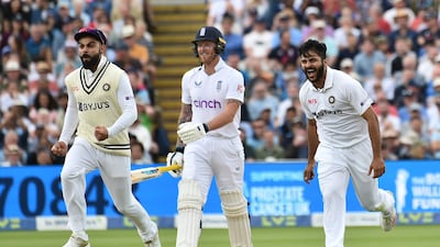 India bowler Shardul Thakur, right, and Virat Kohli, left, after dismissing England's Ben Stokes. AP