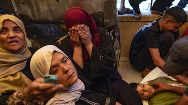 A large-scale funeral takes place at Nasser Hospital in Khan Younis, southern Gaza, after an Israeli air strike killed at least five Palestinians. EPA