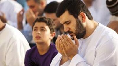 Muslims pray during Eid al Fitr at Al Eid Mosque in Abu Dhabi on September 20, 2009.