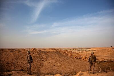 A handout photo made available by the US Marine Corps shows US Marines inside the perimeter of Al Asad Air Base in Iraq. EPA