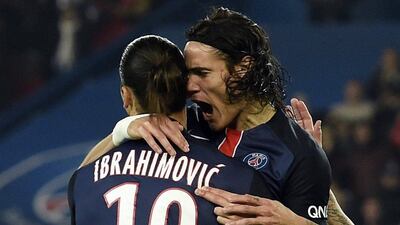 Paris Saint-Germain's Edinson Cavani celebrates with Zlatan Ibrahimovic after a goal in PSG's Ligue 1 win over Saint-Etienne on Sunday. Miguel Medina / AFP / October 25, 2015