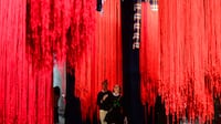 Visitors view an installation by South African artist Senzeni Marasela at the 61st Venice Biennale on Wednesday. The event has been dogged by controversy. AFP