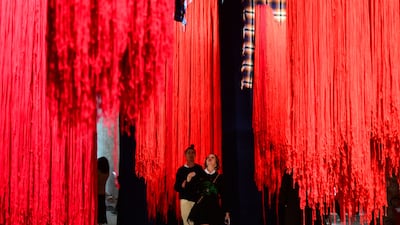 Visitors view an installation by South African artist Senzeni Marasela at the 61st Venice Biennale on Wednesday. The event has been dogged by controversy. AFP