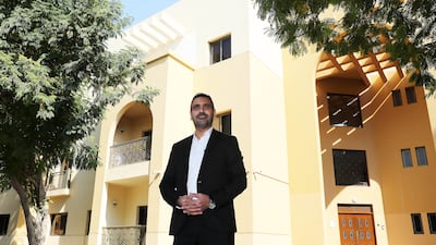 Maroun Farah outside his building in The Gardens in Dubai. Pawan Singh / The National