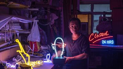 Neon sign maker Wu Chi-kai. He is one of the last remaining craftsmen of his kind in Hong Kong. Philip Fong/ AFP