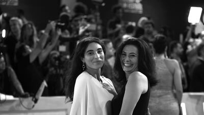 French actress Camelia Jordana, left, and Darina Joundi pose on the red carpet.