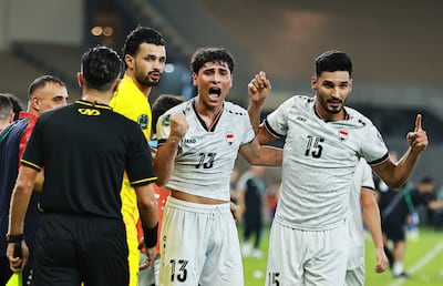 Iraq's Saif Rasheed celebrates scoring their second goal with teammates. Reuters