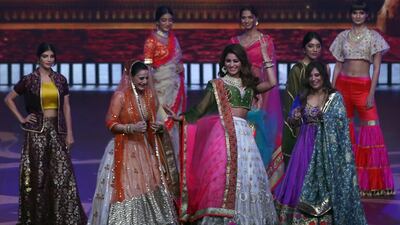 Models present creations by Indian designer Masuma Namjoshi during the IIFA Rocks event as part of the 20th International Indian Film Academy (IIFA) in Mumbai, India, 16 September 2019. Photo: EPA