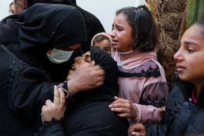 Family members mourn victims of Israeli strikes on Abu Yousef Al Najjar Hospital in Rafah, southern Gaza. Reuters
